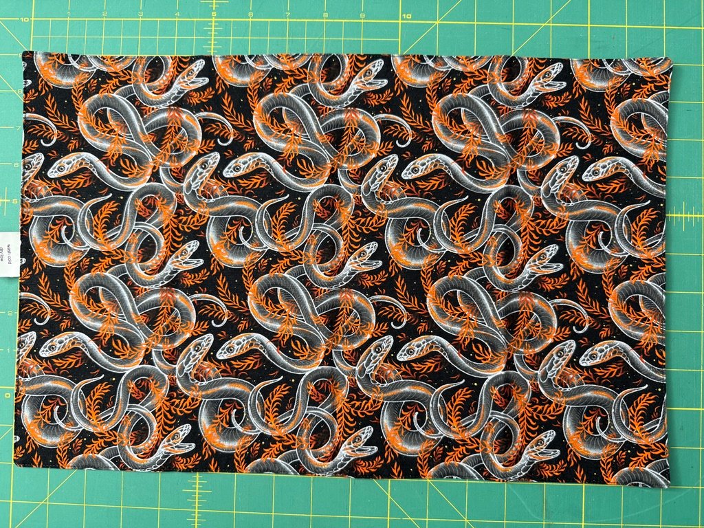 Snakes side of reversible napkin